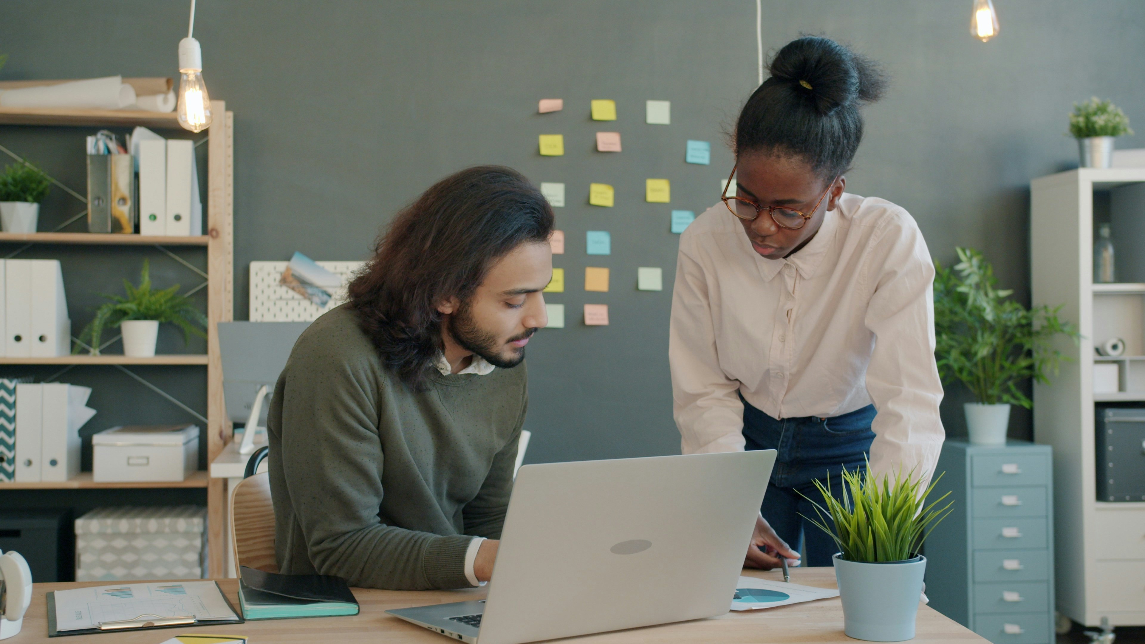 Two colleagues collaborating at desk